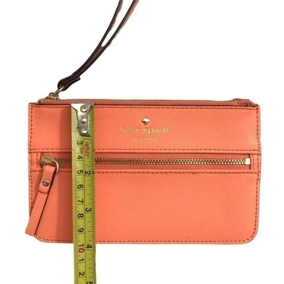 Kate spade peach saffiano leather wristlet bag
